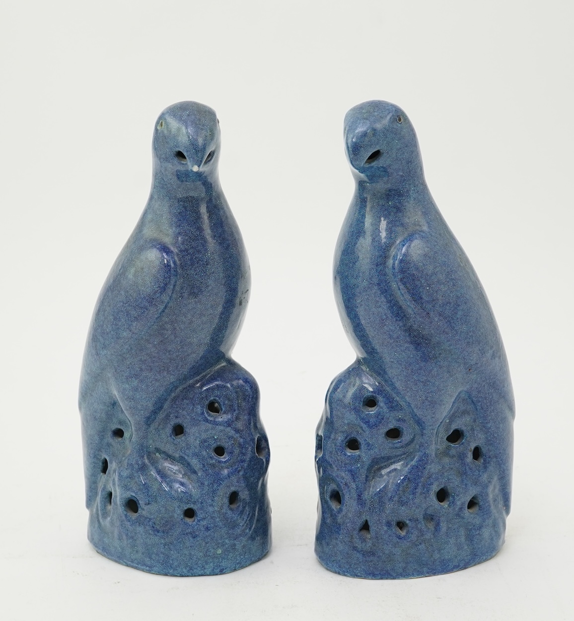 A pair of Chinese blue mottle glazed models of parakeets, 19th century
